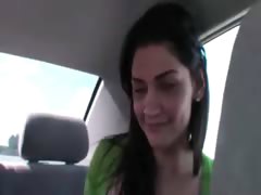 Two brunette girls sucking cock in car