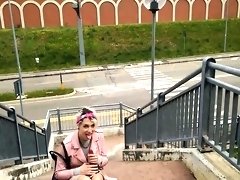 Wild European girl driving herself to climax in public