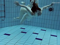slim euro girls lada and anna swim naked in a pool