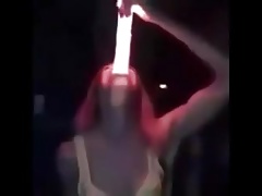 Girl deepthroats a really huge illuminated dildo