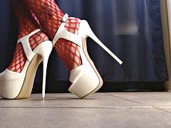 Sexy Foot Fetish Tease in Spiked Heels and Red Fishnet Stockings
