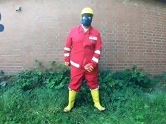 Worker Pup pawing off in red and yellow workgear