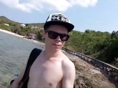 Russian teen walks on the beach and shows his cock in public, but he was seen
