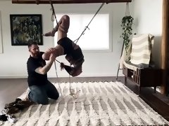 Submissive milf with sexy legs gets restrained and suspended