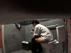 Voyeur spying on a lovely amateur brunette in the toilet